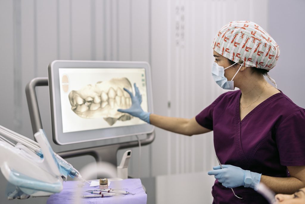 Dental clinic worker showing x-ray